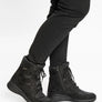 Black winter boots worn by someone