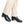 Black leather shoes worn by someone with beige pants
