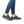 Person in jeans wearing pair of navy blue shoes