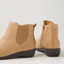 Pair tan ankle boots with zipper